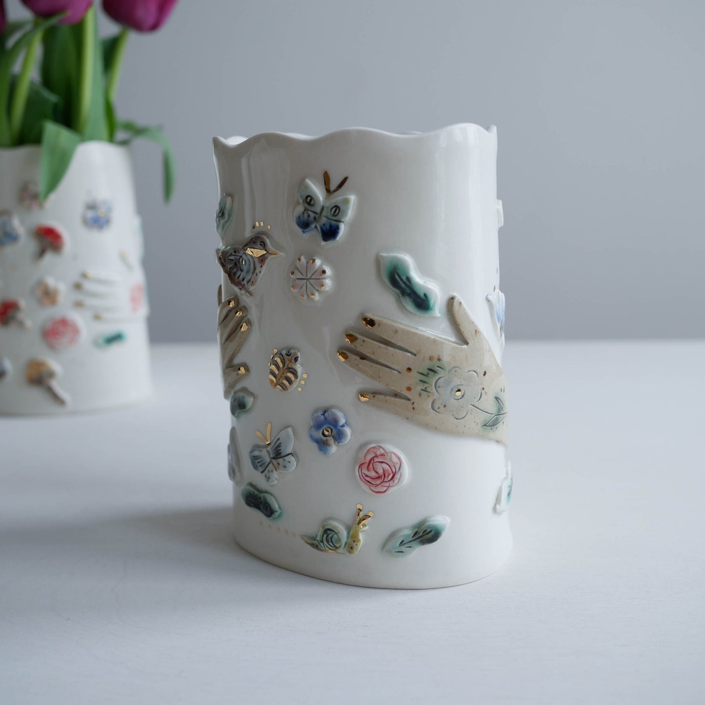 Vase * Bird perched on hand with garden insects #6
