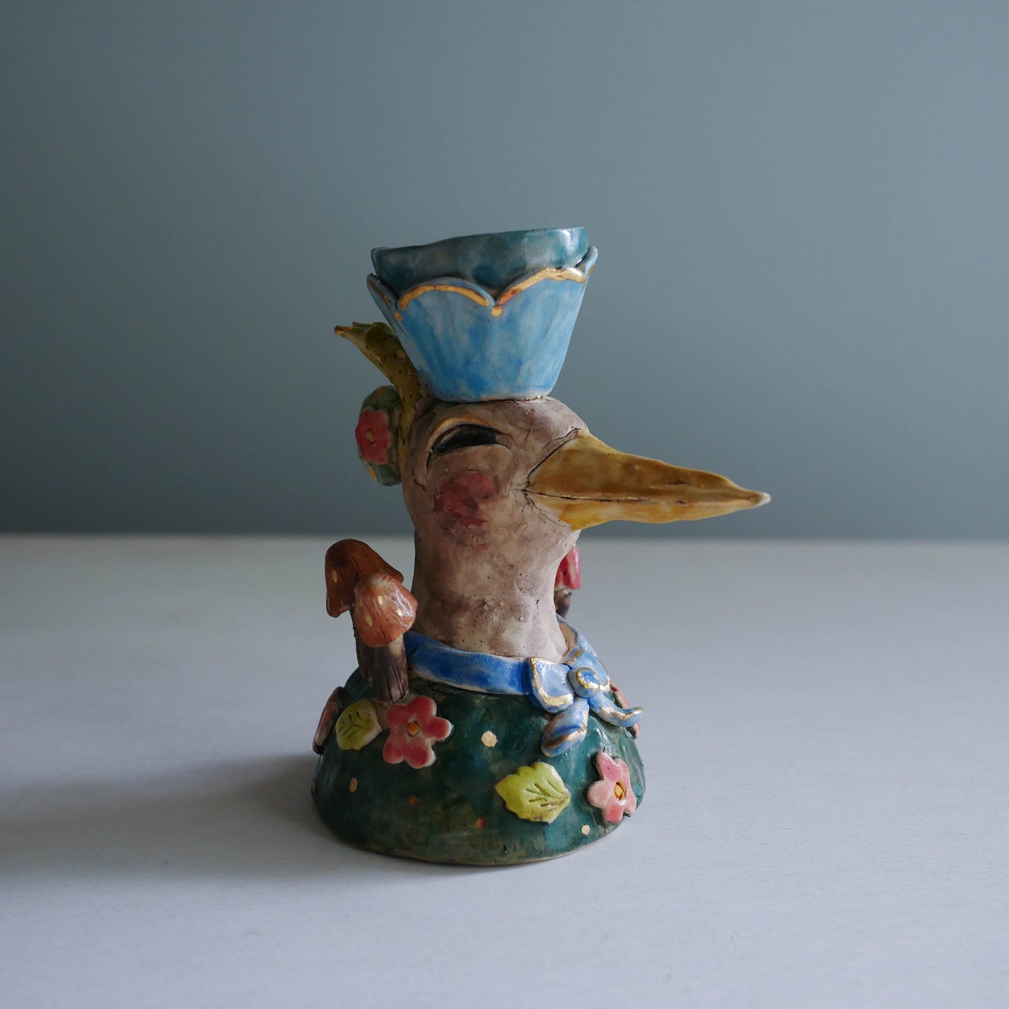 Sculpted bird candle holder/ blue bow
