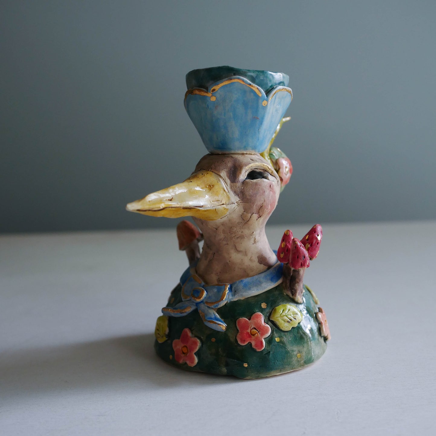 Sculpted bird candle holder/ blue bow