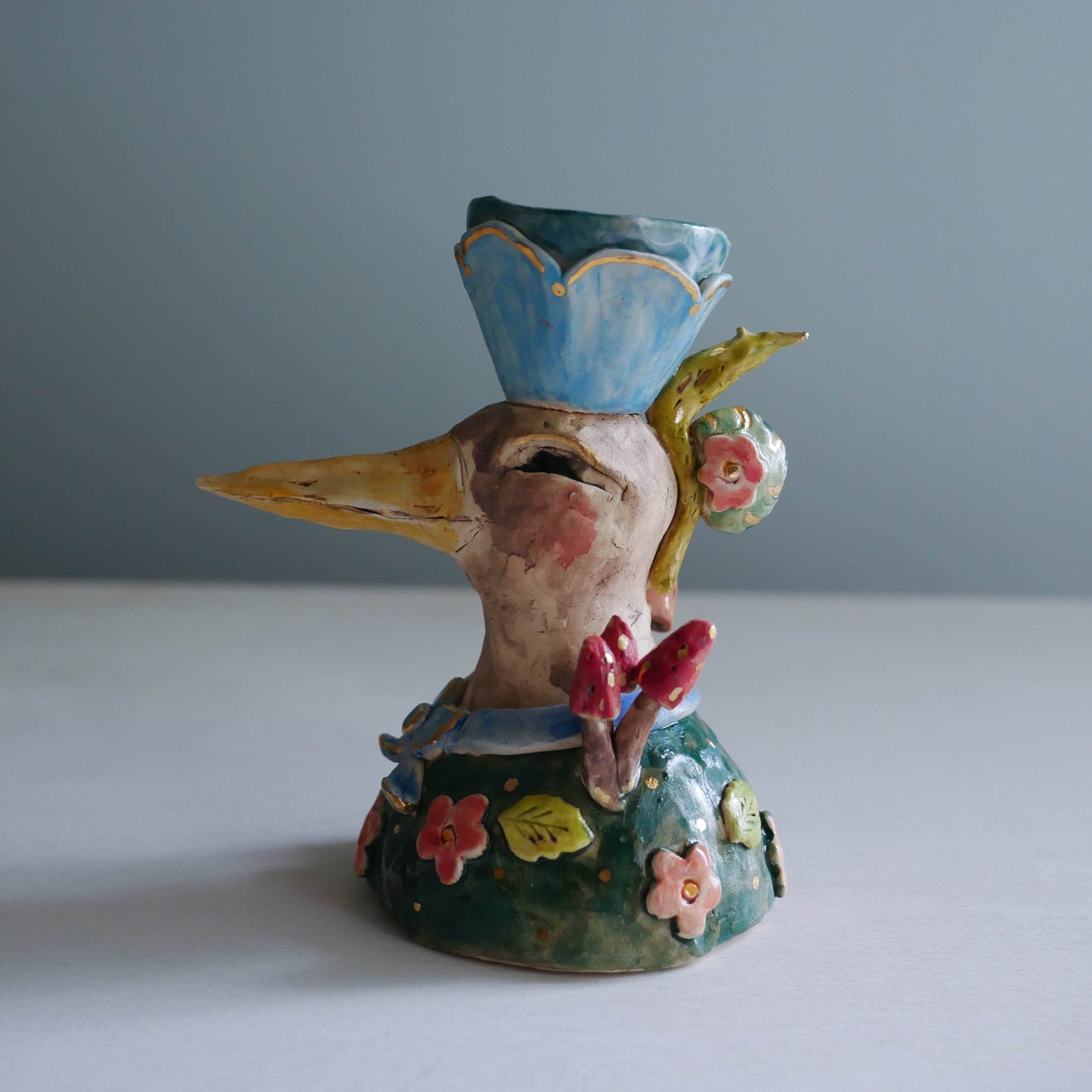 Sculpted bird candle holder/ blue bow