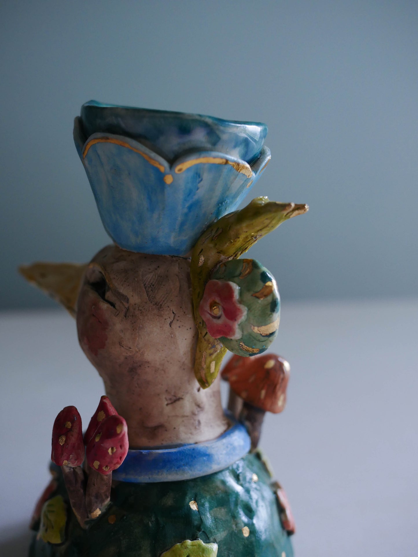 Sculpted bird candle holder/ blue bow